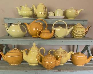 collection features various mid-century modern teapots produced by the Hall China Company, likely including iconic shapes such as the "Aladdin," "Boston," and "Parade" models in yellow