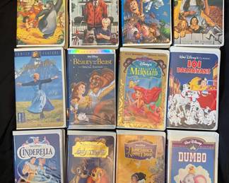 a collection of vintage Disney Black Diamond and classic family clamshell VHS tapes, primarily released in the late 1980s and 1990s