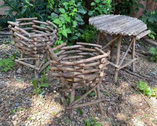 rustic, handcrafted twig furniture pieces often sold as primitive garden decor