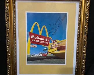 vintage 1960s McDonald's promotional photo features a signed Ronald McDonald figure and is framed in a decorative gold-toned frame