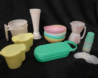 ollection of vintage mid-century Tupperware kitchen items featuring a pastel color palette