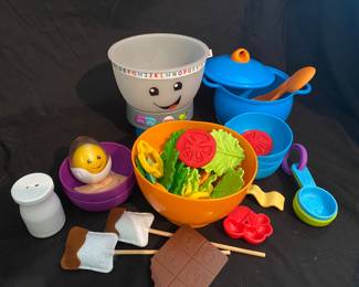 assorted collection of modern toddler play kitchen toys, highlighted by pieces from the Fisher-Price Laugh & Learn Magic Color Mixing Bowl playset