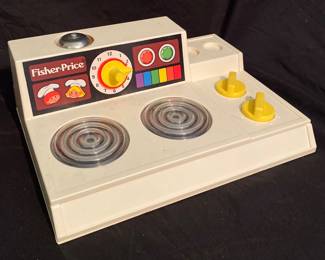 vintage 1978 Fisher-Price "Magic Burner" stove, model number 919.It features functional knobs that make the burners appear to glow and a dial that activates a timer bell