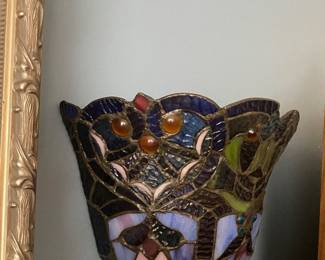 Pair of Tiffany-style wall sconce from River of Goods features multicolored stained glass and a bronze finish