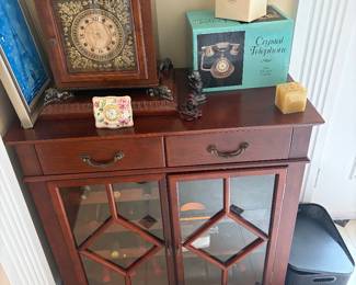 Foyer table .clocks and telephones