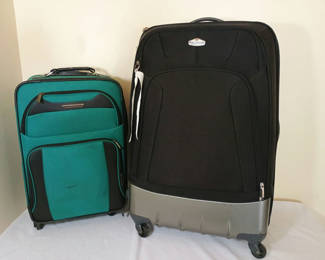 Lot 60: Three pieces of luggage: two rolling suitcases and a backpack