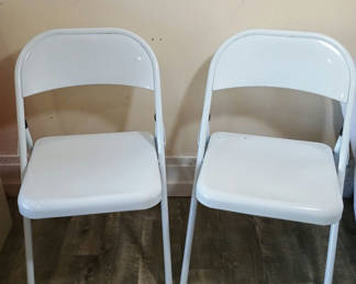 Lot 68: Two white metal folding chairs