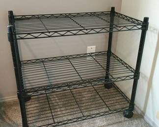 Lot 16: Rolling black metal shelf