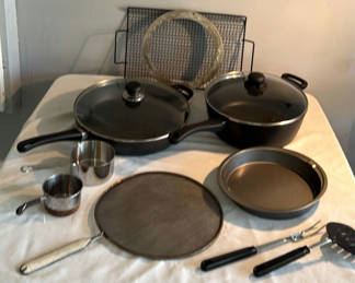 Lot 56: Cookware set with pans, lids, grill pan, rack and measuring cups