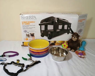 Lot 43: Rolling pet carrier and supplies