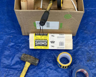 Lot 66: Wood shims, hammer, measuring wheel, and tape