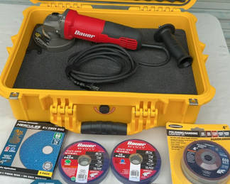 Lot 55: Angle grinder with assorted grinding, cutting, and polishing discs in a protective yellow case