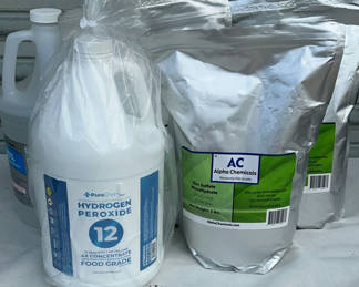 Lot 123: Hydrogen peroxide, isopropyl alcohol, and zinc sulfate monohydrate containers