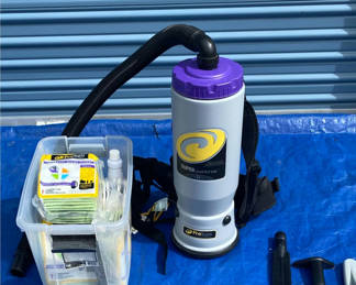 Lot 61: ProTeam Super QuarterVac backpack vacuum with accessories and replacement filters