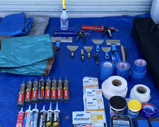 Lot 111: Caulking guns, sealants, tapes, and hand tools