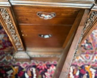 view of desk drawers on each side of chair