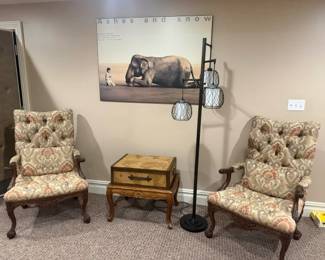 Printed armchairs, lamp, table, trunk and art