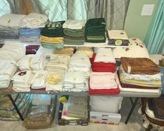 WALL LENGTH TABLE FULL OF LINENS!