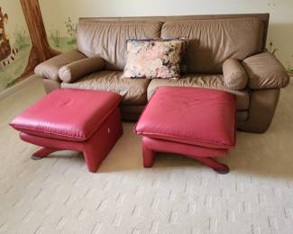 3 real leather ottomen by Nicoletti Salotti. (Look up retail price) 2 red & 1 darker red