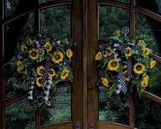 PAIR OF ARTIFICIAL SUNFLOWER WREATHS WITH BLACK & WHITE RIBBONS