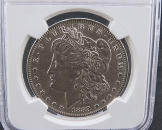 Lot 81. 1889 P Morgan Silver Dollar slabbed and graded NGC AU 58