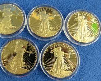 Lot 126. Five replica $20 Gold Eagle coins stamped "COPY"
