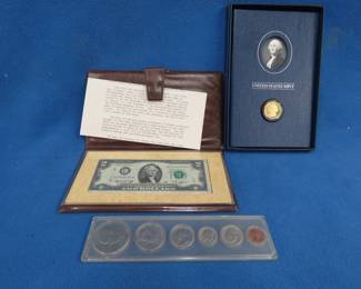 Lot 123. Three collectible coin sets: Type set from 1976. First Day of Issue $2 bill from April 134, 1976. Gold-colored Historical George Washington Signature Set with one dollar coin