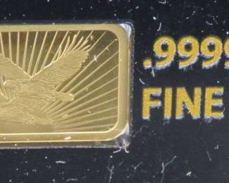 Lot 142. National Collector's Mint Double Eagle bar with 1/100th ounce (approx. 1/2" x 1/4") of pure .9999 gold. of pure .9999 gold. Identical to lot 140. The same photos were used.