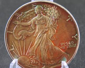 Lot 335. 1991 American Silver Eagle with major toning. One troy ounce of .999 Silver