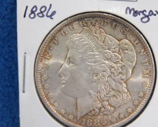 Lot 265. 1886 with toning Morgan Silver Dollar