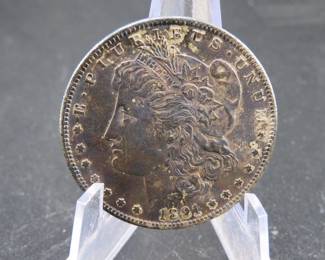 Lot 92. 1891 S toned Morgan Silver Dollar