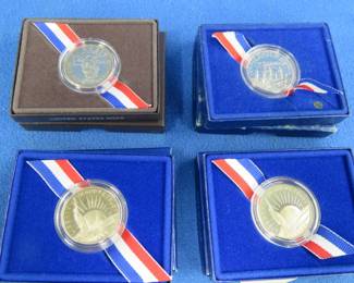 Lot 163. Three 1986 and one 1989 commemorative Half Dollar coins