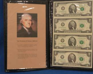 Lot 118. Four uncut 2003 Series A $2 bills in a folder from the World Reserve Monetary Exchange