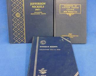 Lot 69. Two partially full coin folders and a book: Buffalo Nickel folder 1913 - 1938. Jefferson Nickels 1965 and on. 1965 Handbook of U.S. coins