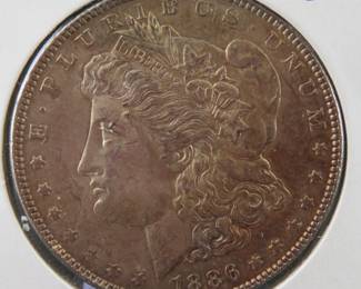 Lot 303. 1886 Morgan Silver Dollar with toning