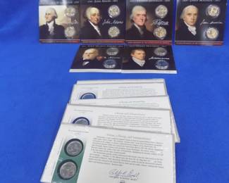 Lot 60. 24 commemorative U.S. Dollar or Quarter coins: 12 dollar coins honoring the first six presidents. Six cards each with two State Quarters commemorating several of the first states to ratify the Constituion.