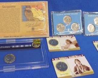 Lot 61. 11 commemorative U.S. Dollar coins: Six Susan B. Anthony dollar coins. Four Sacagawea dollar coins. One President Grant dollar coin.