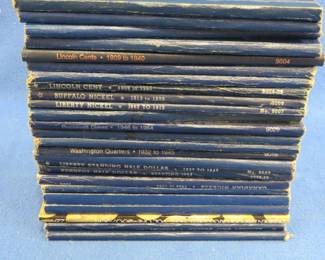 Lot 128. 25 empty coin albums in excellent condition including pennies, nickels, dimes, quarters, halves and dollar coins