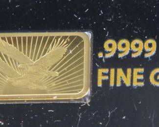 Lot 140. National Collector's Mint Double Eagle bar with 1/100th ounce (approx. 1/2" x 1/4") of pure .9999 gold.