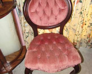 Antique carved tufted chair