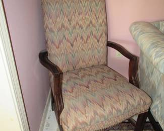 One of two upholstered arm chairs