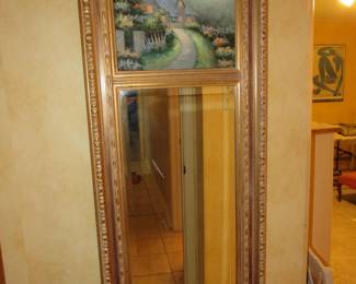 Beveled peer mirror with oil painting at the top