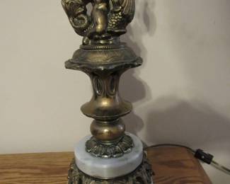 Cherub riding dolphin