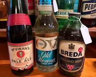 Assortment of Collectable Bottled Beers Full with Original Caps: McEwan's India Pale Ale, O'Keefe Old Vienna Lager Beer, Breda Holland Beer