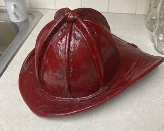 Antique Firemen's Fire Helmet. Cairns Bros. of New York. Embossed Leather with top brass clip. Has been painted red.