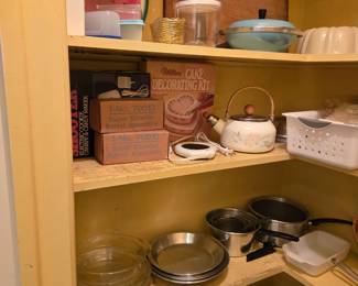 Pantry filled with Bakeware (pie pans, bundt cake), Cutting Boards, Cookware Pots/Pans,, Wilton Cake Decorating Kit, Super Shooter Barrel Assembly (2 qty), Teapot, Mirro Matic Electric 30 Cup Percolator in Box and much more!