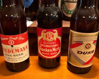 Assortment of Collectable Bottled Beers Full with Original Caps: Wiedmann Fine Beer, IBI Int'l FrankMuth Boc Beer, Duke Beer and much more!
