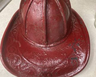 Antique Firemen's Fire Helmet. Cairns Bros. of New York. Embossed Leather with top brass clip. Has been painted red.