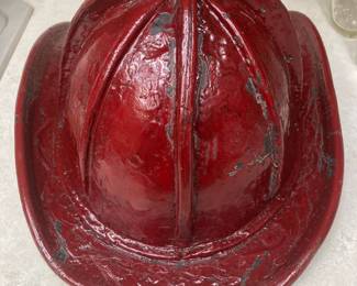 Antique Firemen's Fire Helmet. Cairns Bros. of New York. Embossed Leather with top brass clip. Has been painted red.