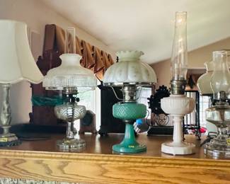 Antique and vintage oil lamps, some electrified